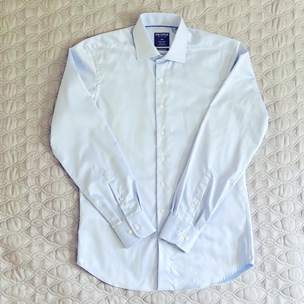 Proper dress shirt, wrinkle free, light blue.
